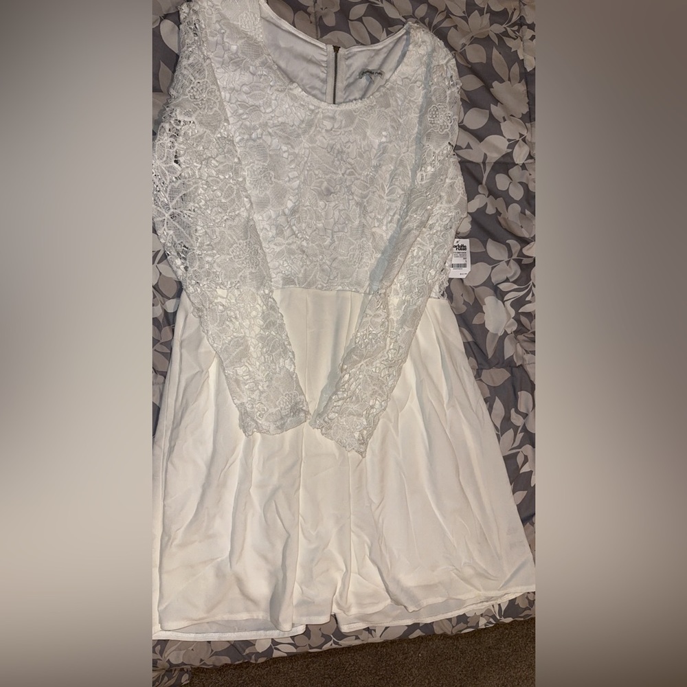 White dress, with lace sleeves. Brand new with tags, never worn.